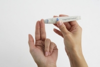 Prick your finger with the Roche Softclix lancing device Prick your finger with the Roche Softclix lancing device